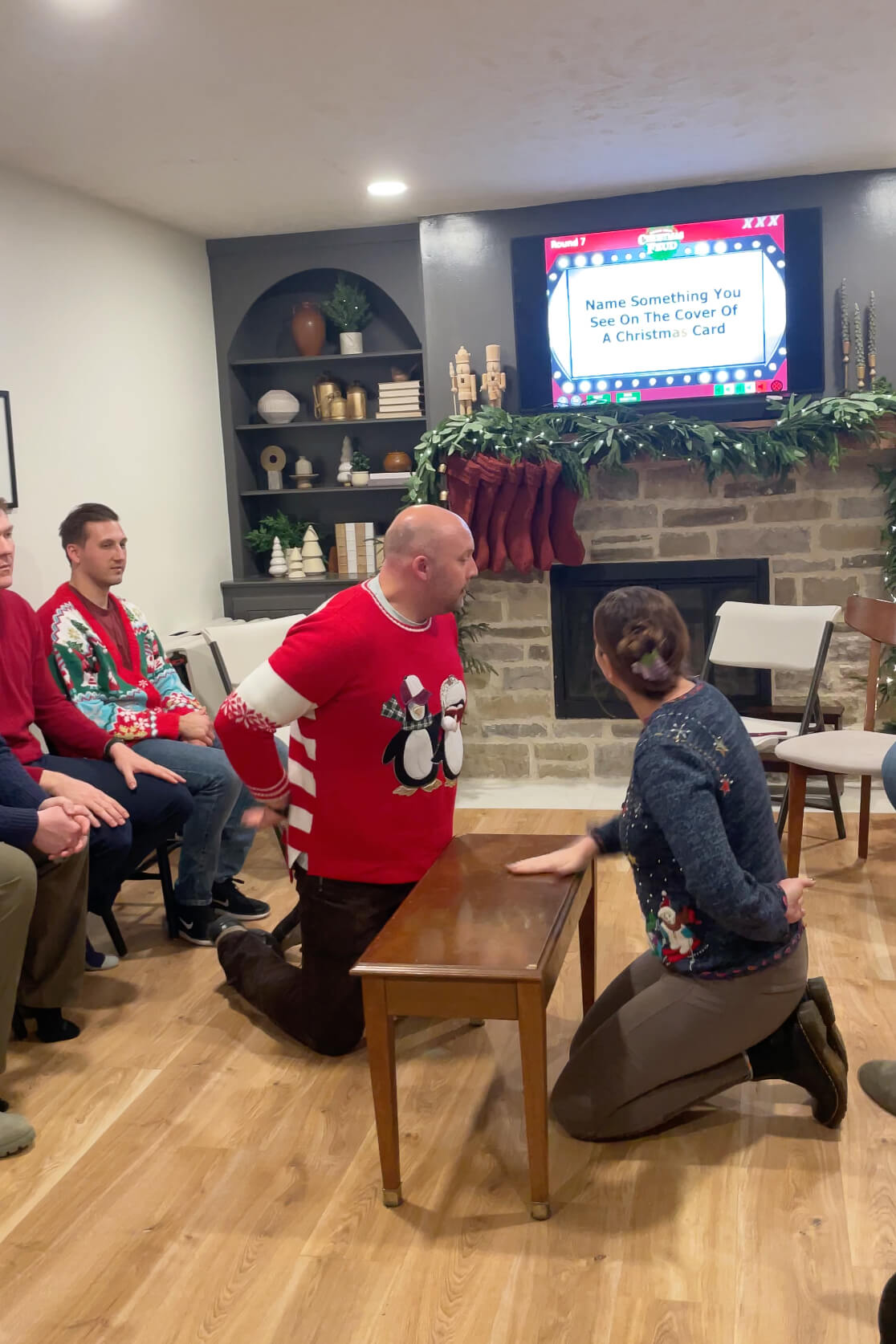 Playing Holiday Family Feud at our Christmas party with adult friends.